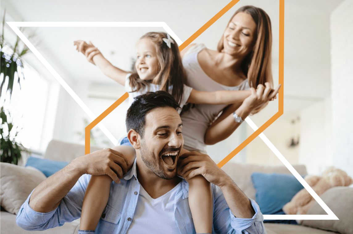 A man and woman are playing with their daughter.